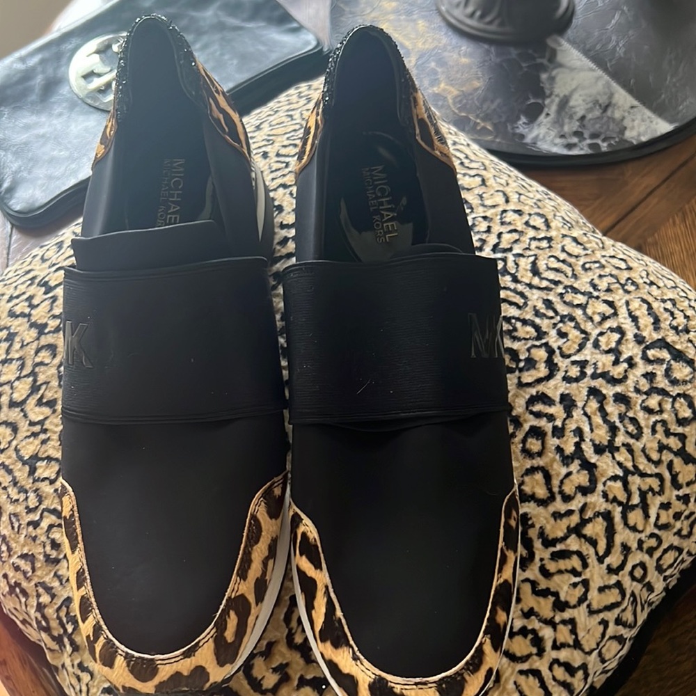 Michael Kors slip on sneaker with leopard detail.